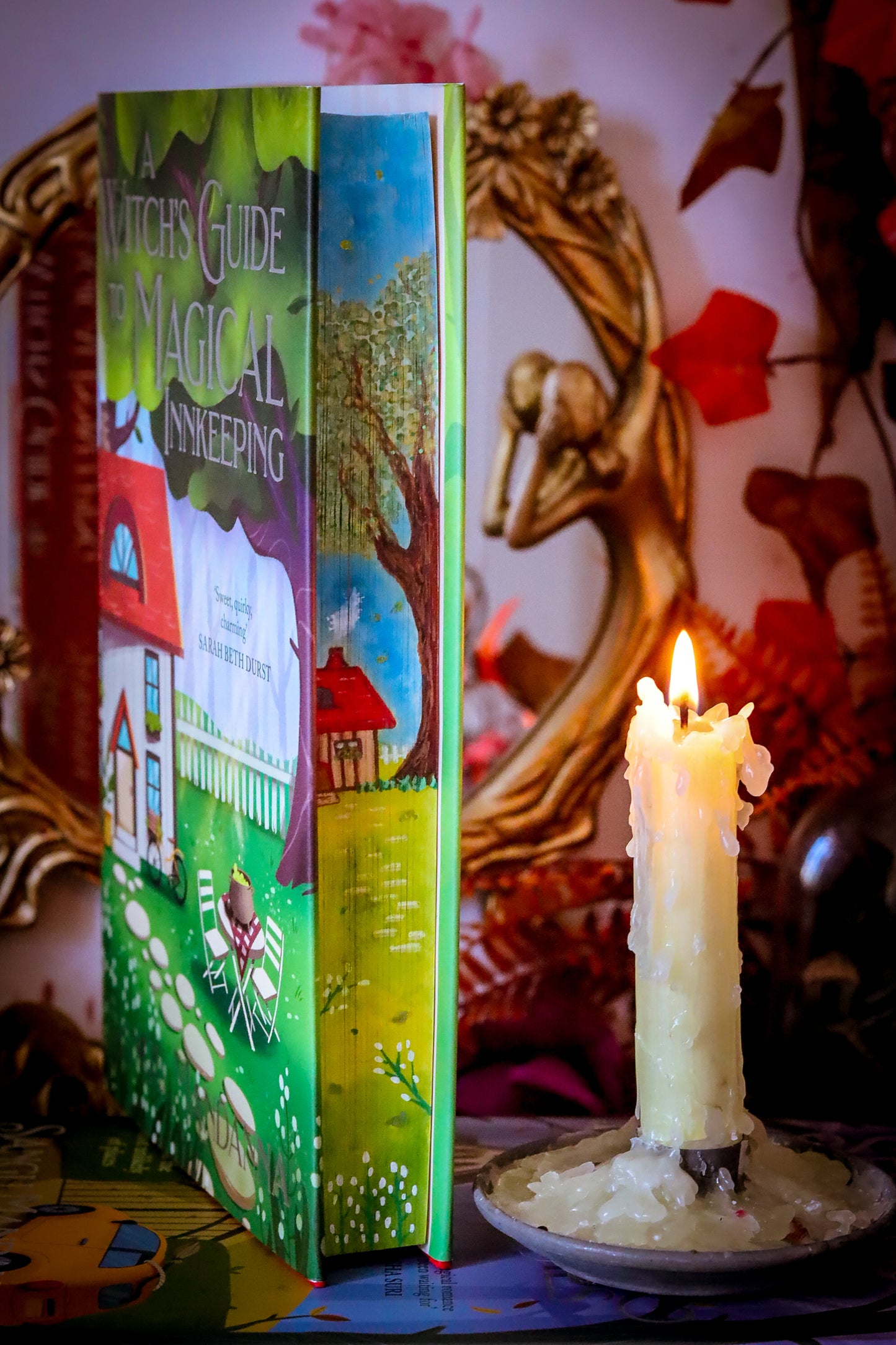 The Very Secret Society of Irregular Witches & A Witch's Guide to Magical Inkeeping hand-painted book edges - books by Sangu Mandana