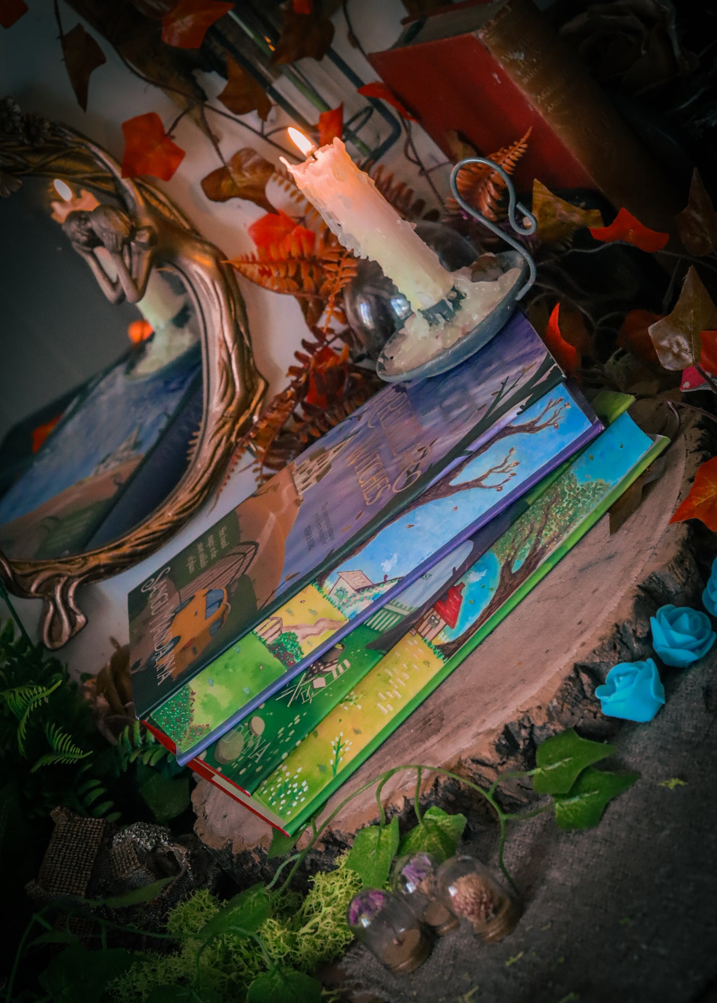 The Very Secret Society of Irregular Witches & A Witch's Guide to Magical Inkeeping hand-painted book edges - books by Sangu Mandana