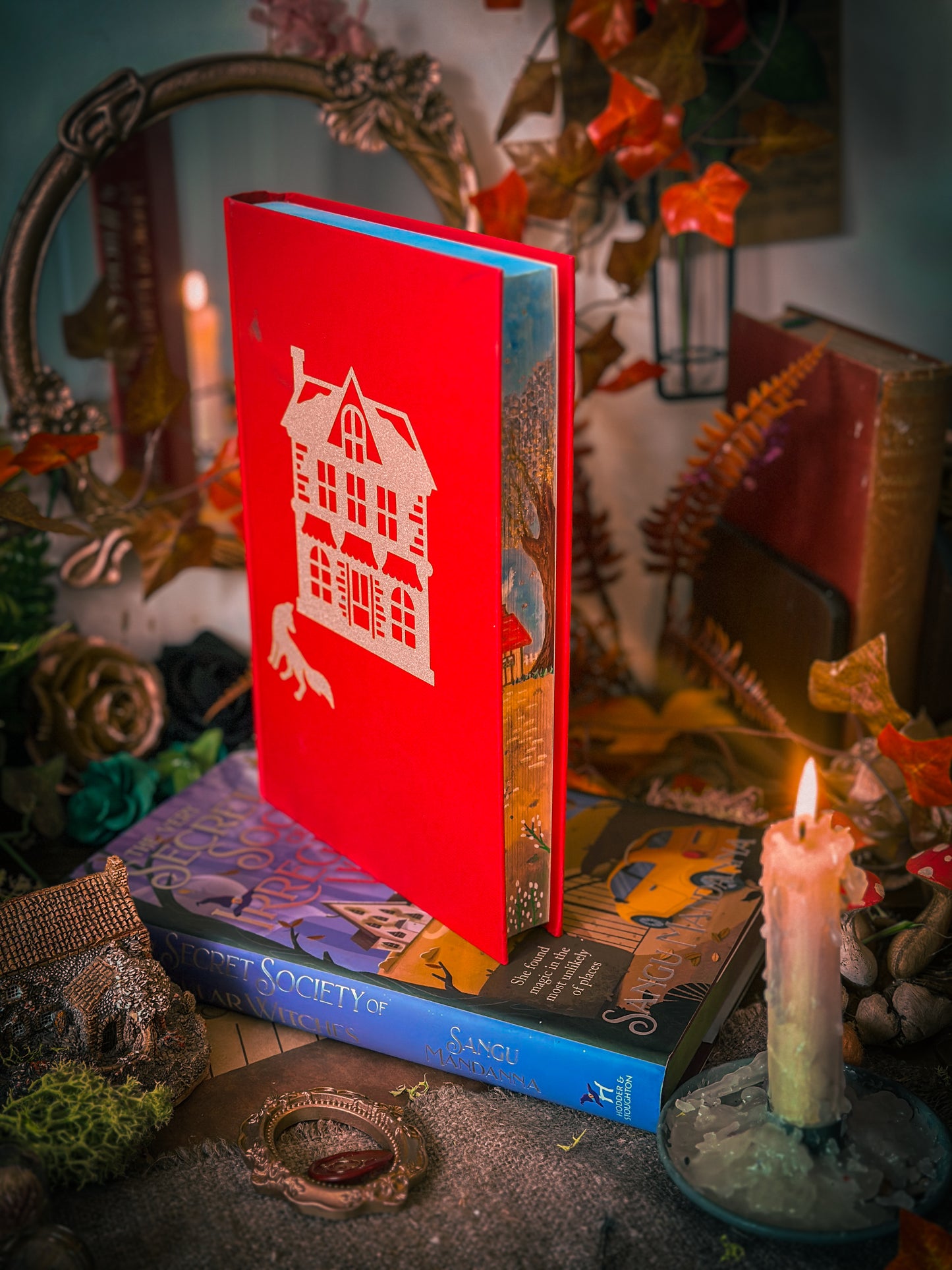 The Very Secret Society of Irregular Witches & A Witch's Guide to Magical Inkeeping hand-painted book edges - books by Sangu Mandana