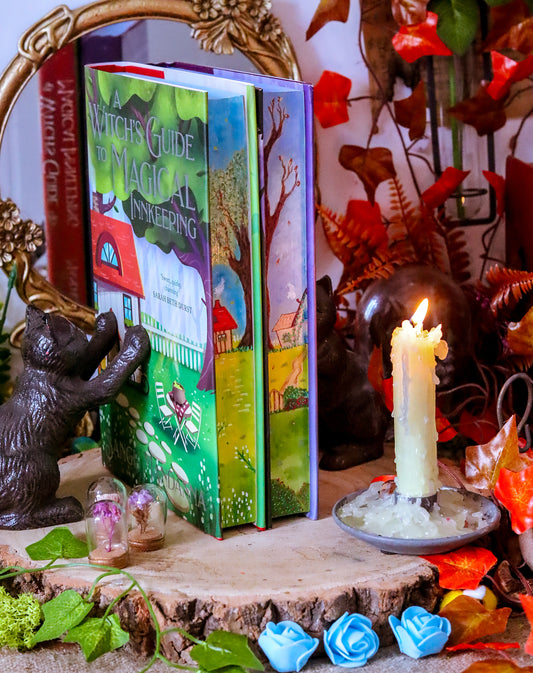 The Very Secret Society of Irregular Witches & A Witch's Guide to Magical Inkeeping hand-painted book edges - books by Sangu Mandana
